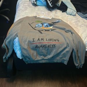 a tan vintage sweater fits really i loved it but just don’t wear it anymore.